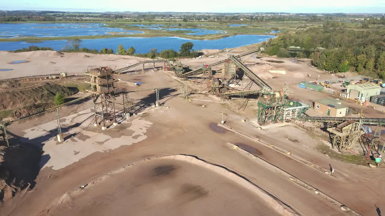 Drone footage of quarry machines and conveyers