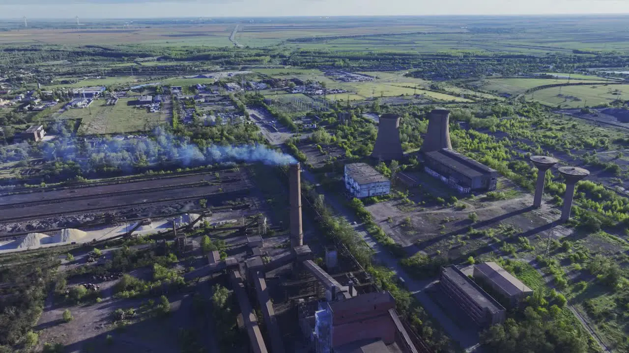 Metal recycling plant drone push-in tilt-down shot