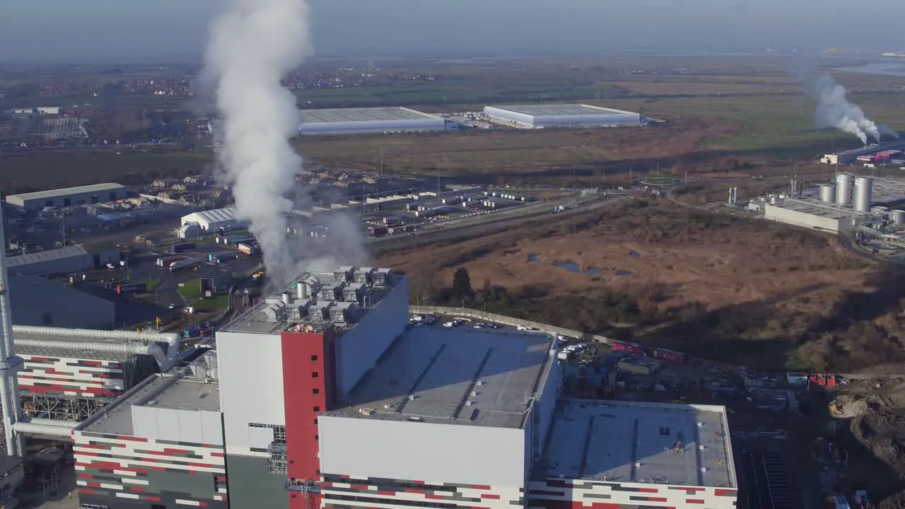 Wide aerial view of steam billowing from the newly constructed K3 Powerstation a waste paper power station in Kemsley UK