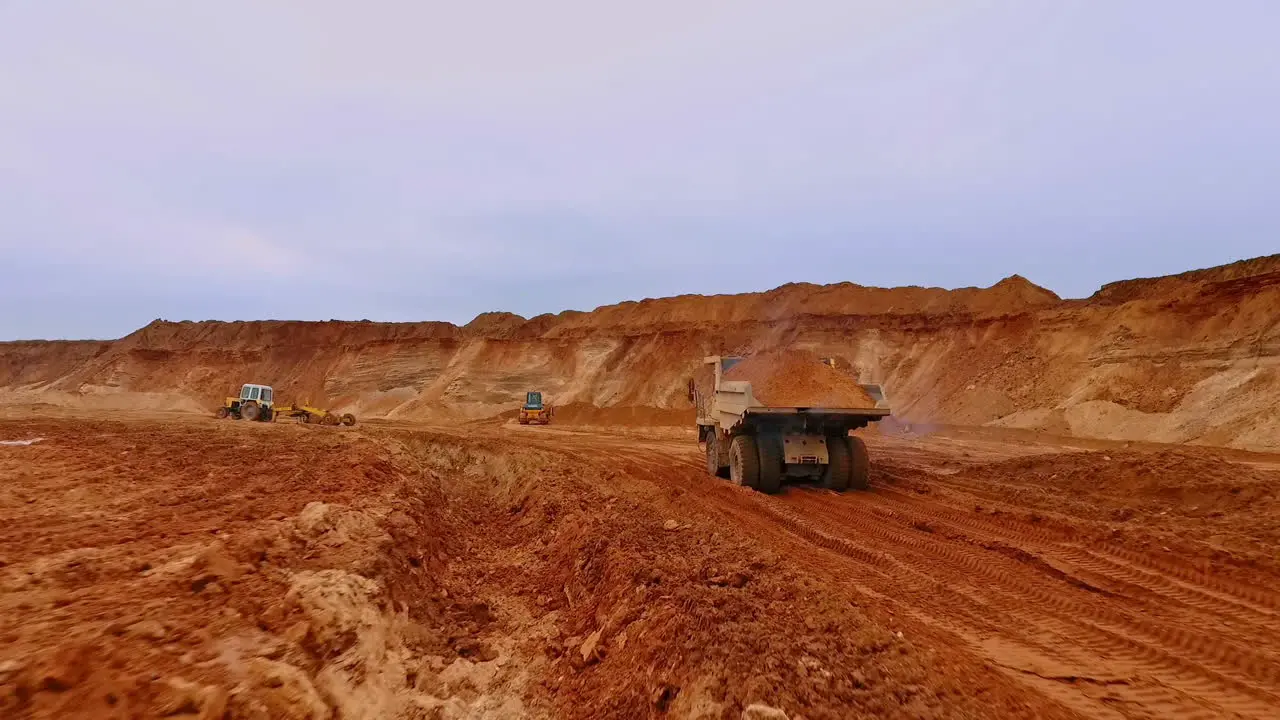 Tipper truck carries sand Drone view of dump truck transporting sand on quarry