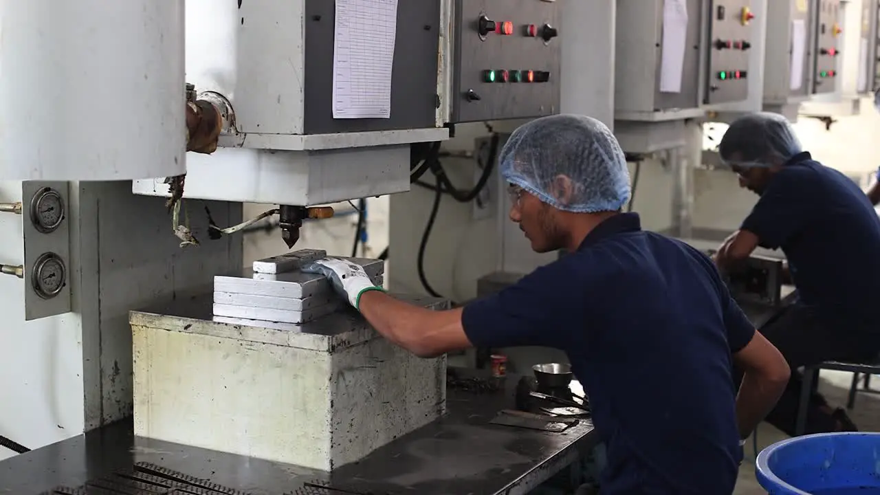 scene in which a wax mold design is being prepared in an automatic press machine for an investment casting foundry