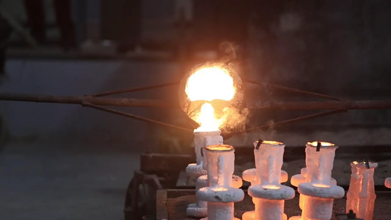 Castings heated to high degrees Celsius are carefully filled into molds in sand casting foundries