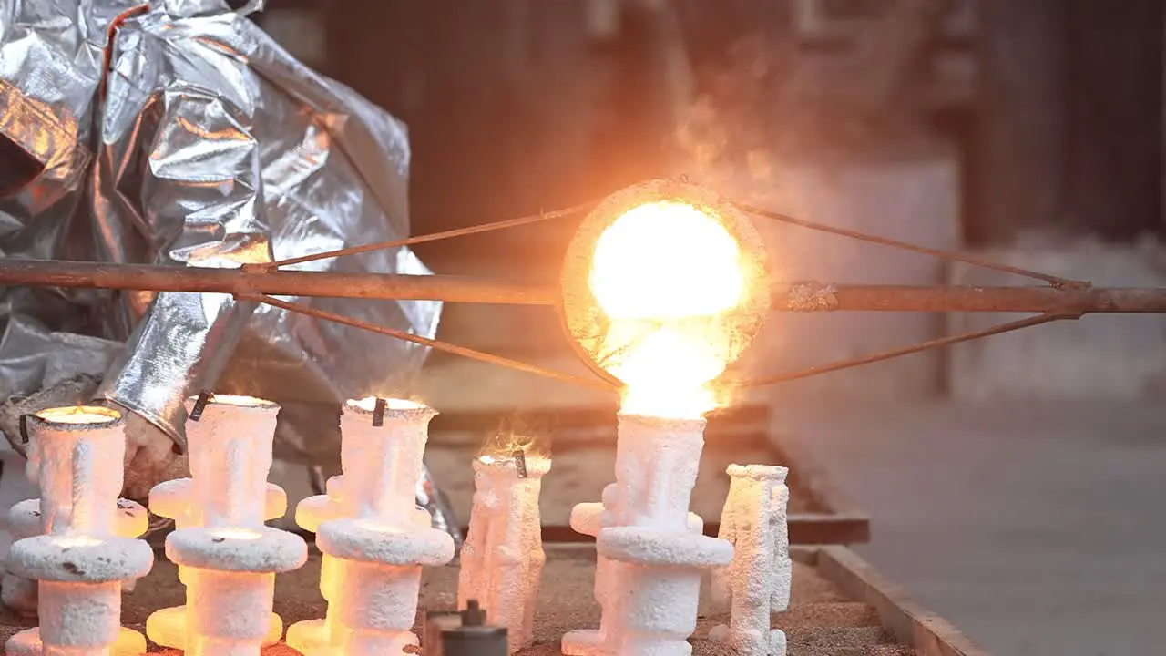 The casting prepared in high celsius heat is being filled inside the mold and working with safety purpose in mind