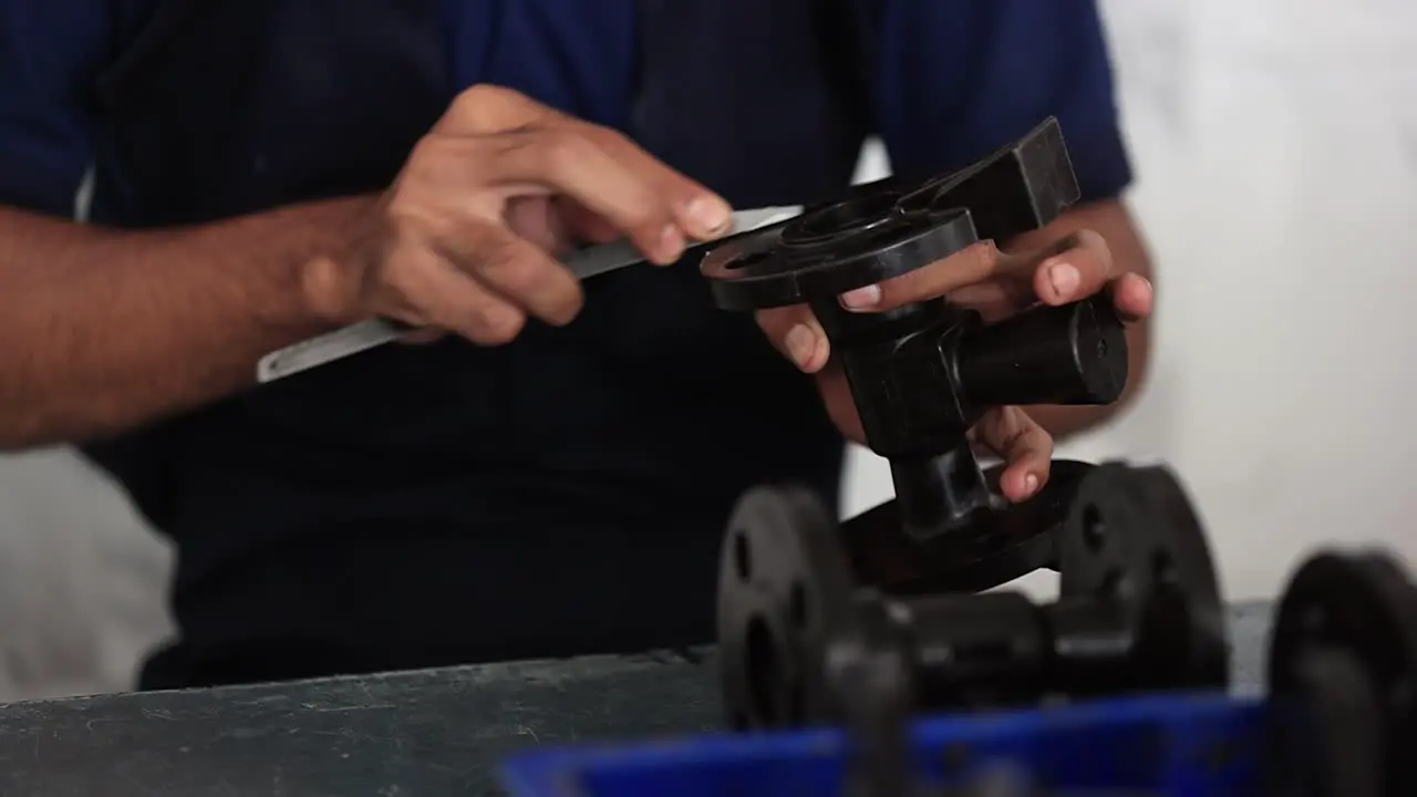 slow motion scene in which an employee is checking the quality of the prepared wax mold