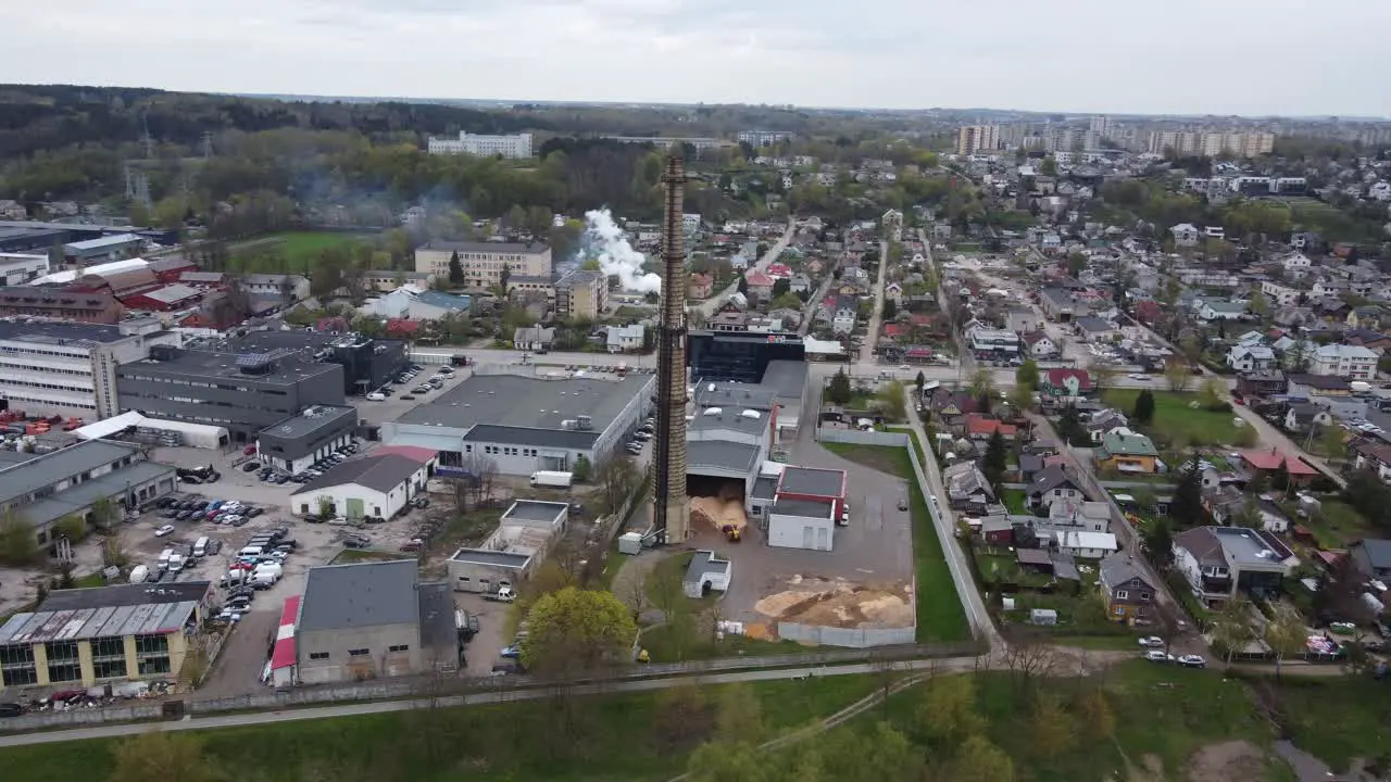 Aerial parallax view of power plant chimney