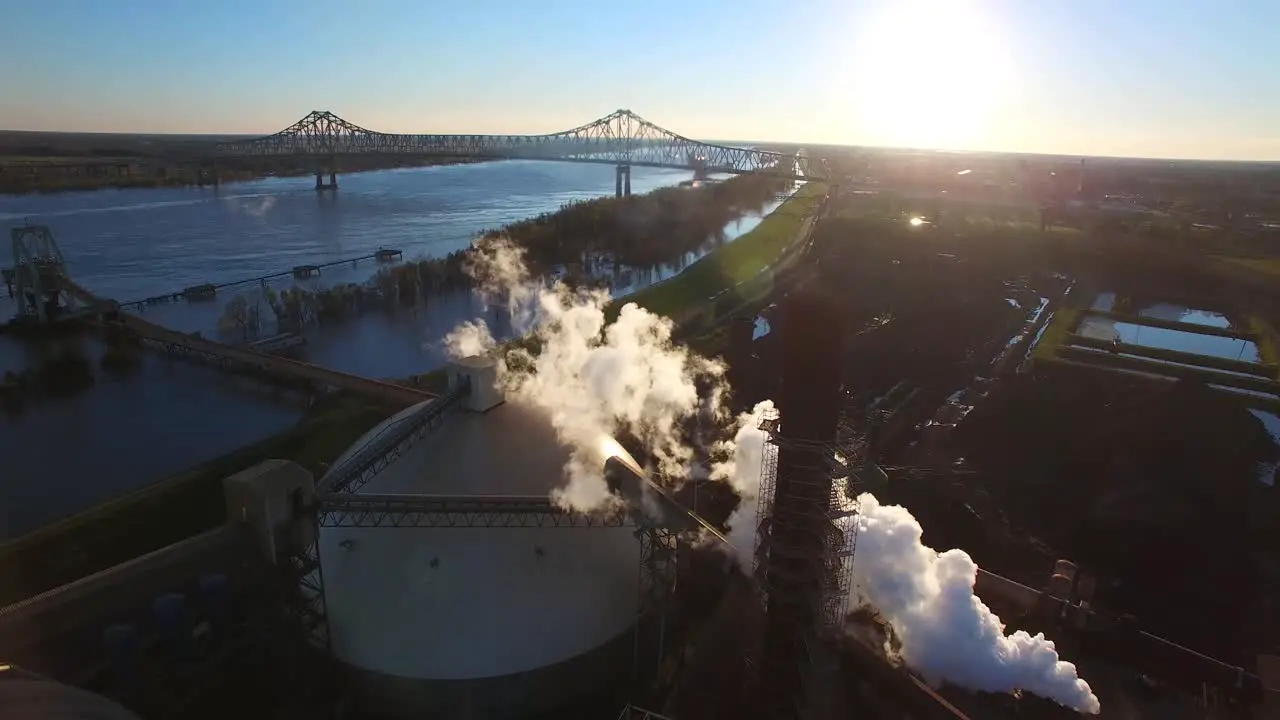 Aerial over an industrial aluminum manufacturing plant along the Mississippi River 1