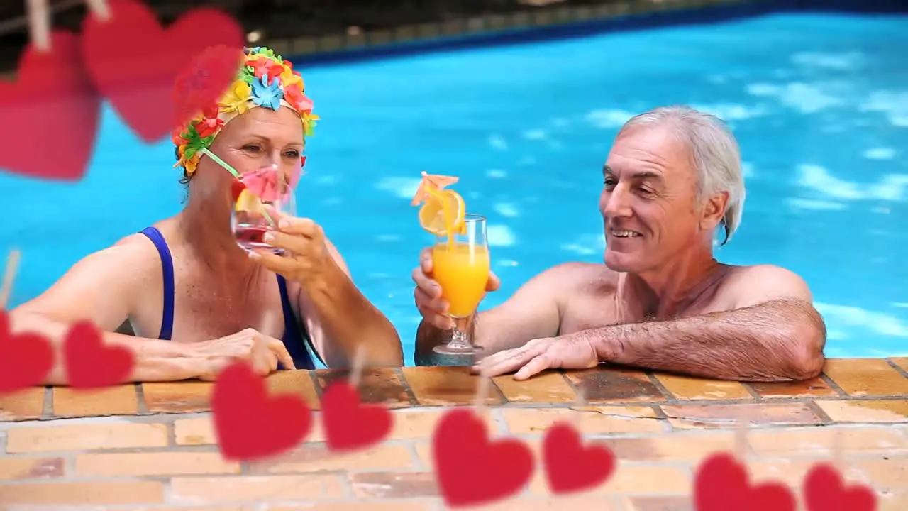 Mature couple having fun at a swimming pool