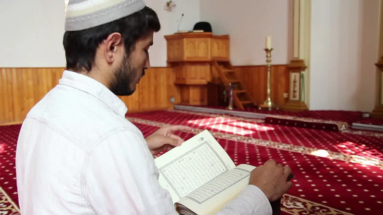 Man Reading Quran In Mosque