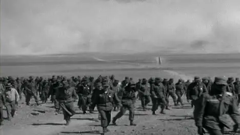 1955 American Military Personnel Walking Uphill In the Desert 