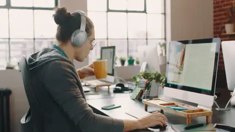 Creative man and computer while drinking coffee