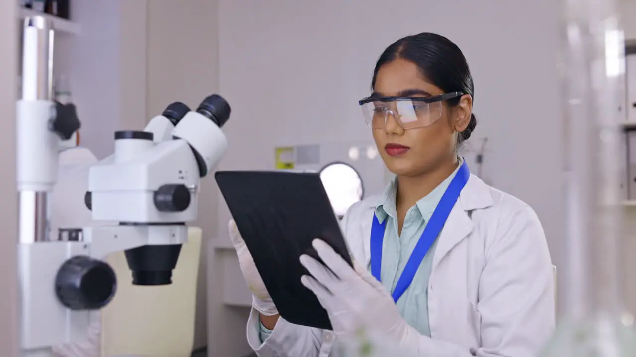 Tablet research and science woman in laboratory