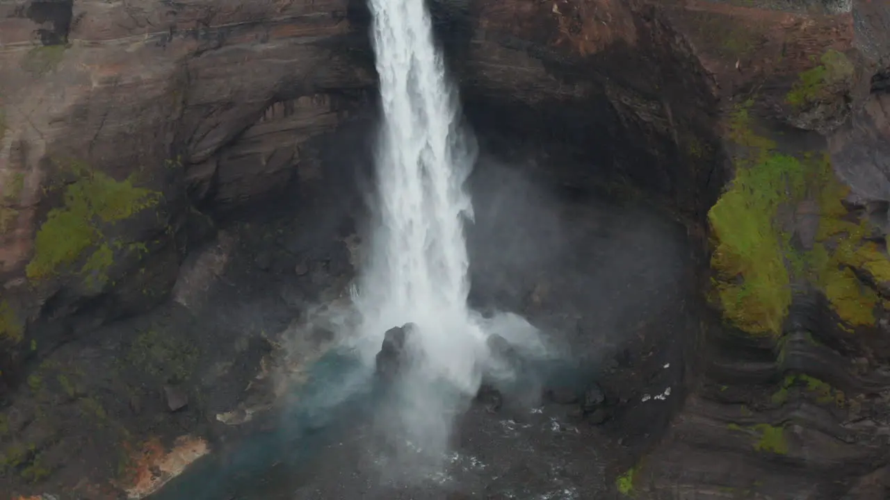 Aerial view of Haifoss waterfall splashing into Fossa river in Iceland highlands Drone view of one of most important powerful icelandic cascade flowing in Landmannalaugar canyon valley