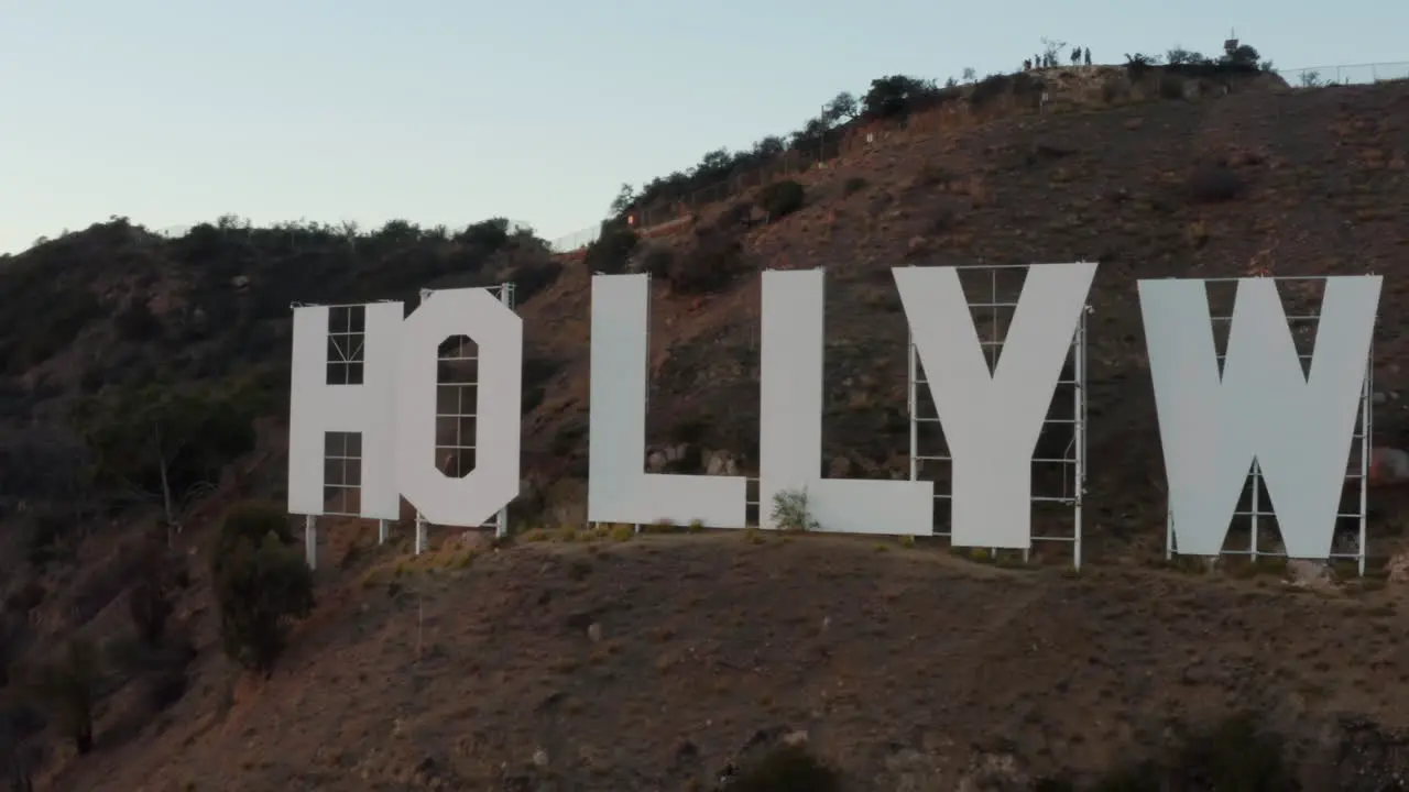 AERIAL Very close to Hollywood Sign at Sunset Los Angeles California