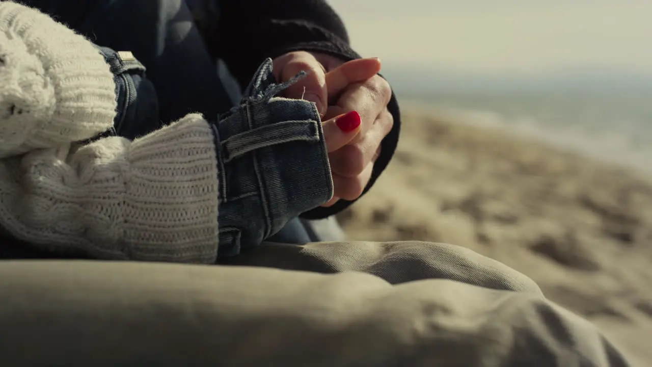 Romantic couple hands touching each other on sea beach People hold arms outside