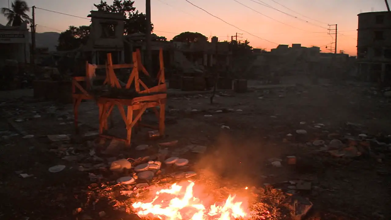 An open fire burns on the streets of Haiti following an earthquake 2