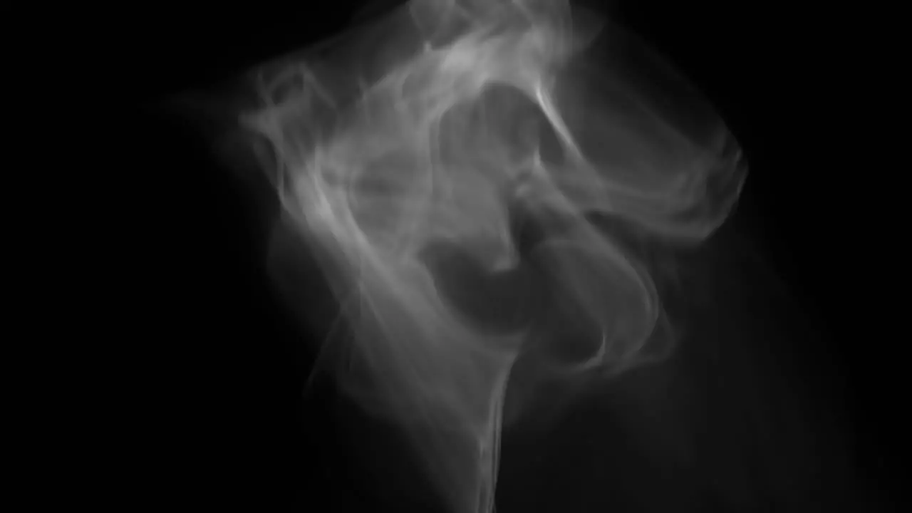 White smoke that rises slowly and floats suspended in the air