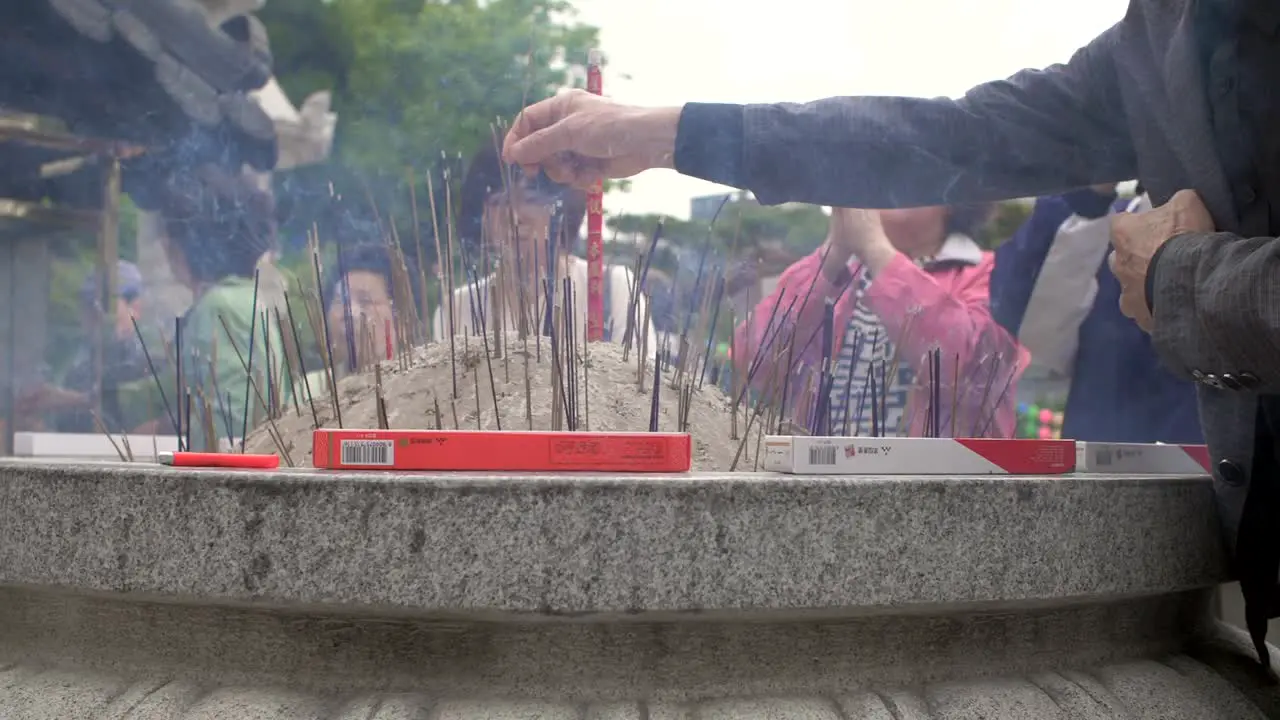 Offering Incense in Buddhist Temple