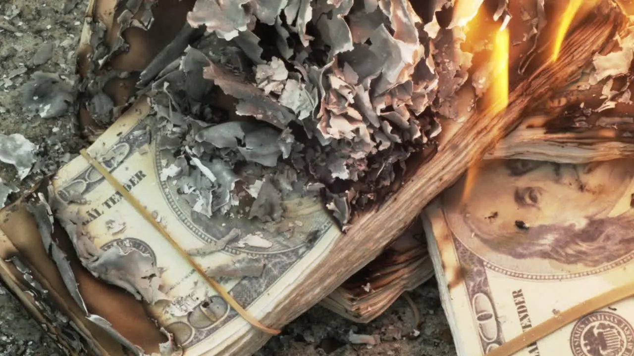 Close up of prop money on fire