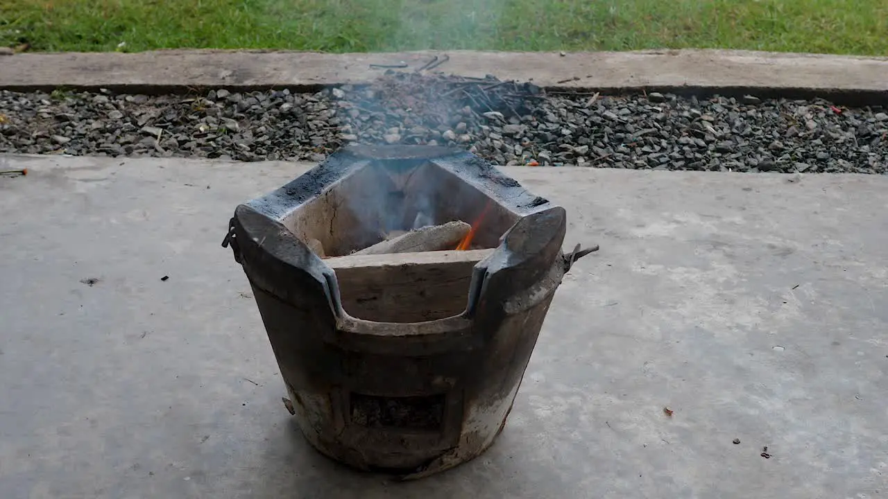 Small open fire stove burning in preparation for cooking