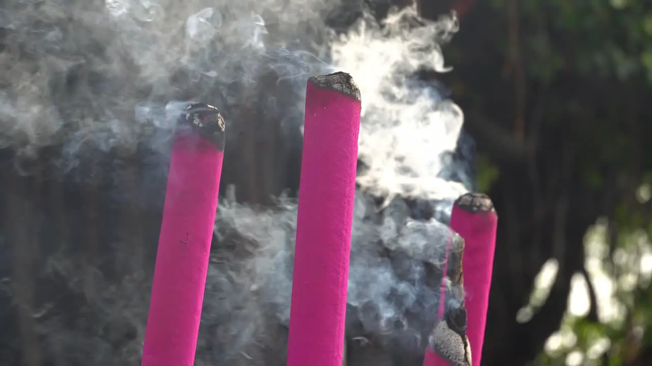 Red joss stick release smoke during burn