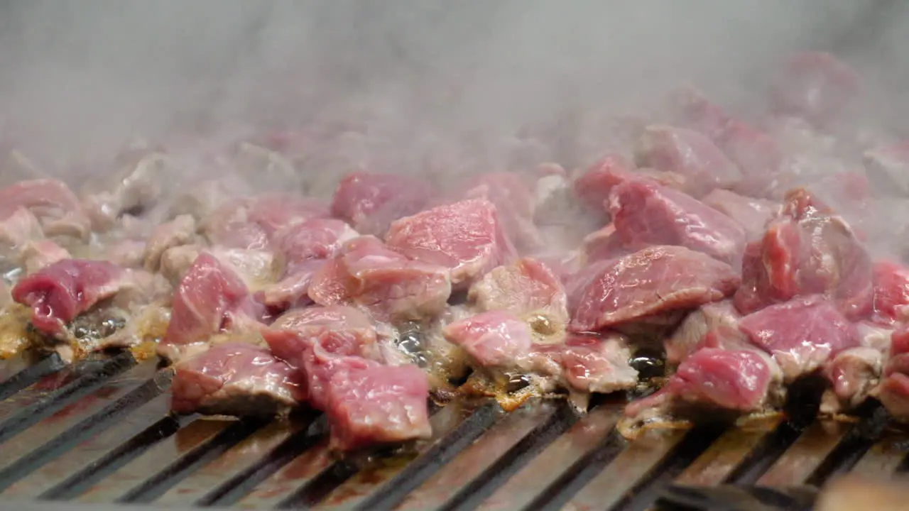 Meat strips closeup on professional grill