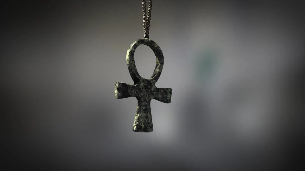 High quality close up render of a beautiful antique carved marble Egyptian Ankh artifact swinging slowly on the end of a neck chain with super shallow depth of field abd bokeh background