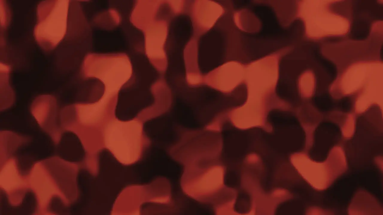 Looping animations of an orange and black liquid camouflage like pattern