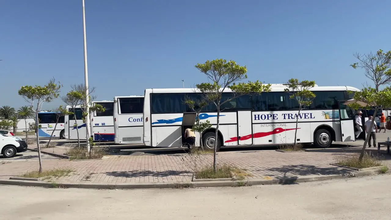 Scenes of tour coaches for tour excursions parked outside La Goulette Cruise Port Tunisia