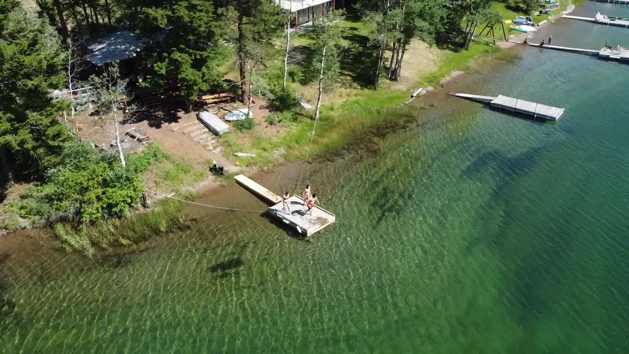 2 girls and 1 guy jumping into Alice Lake BC Canada Circling Around