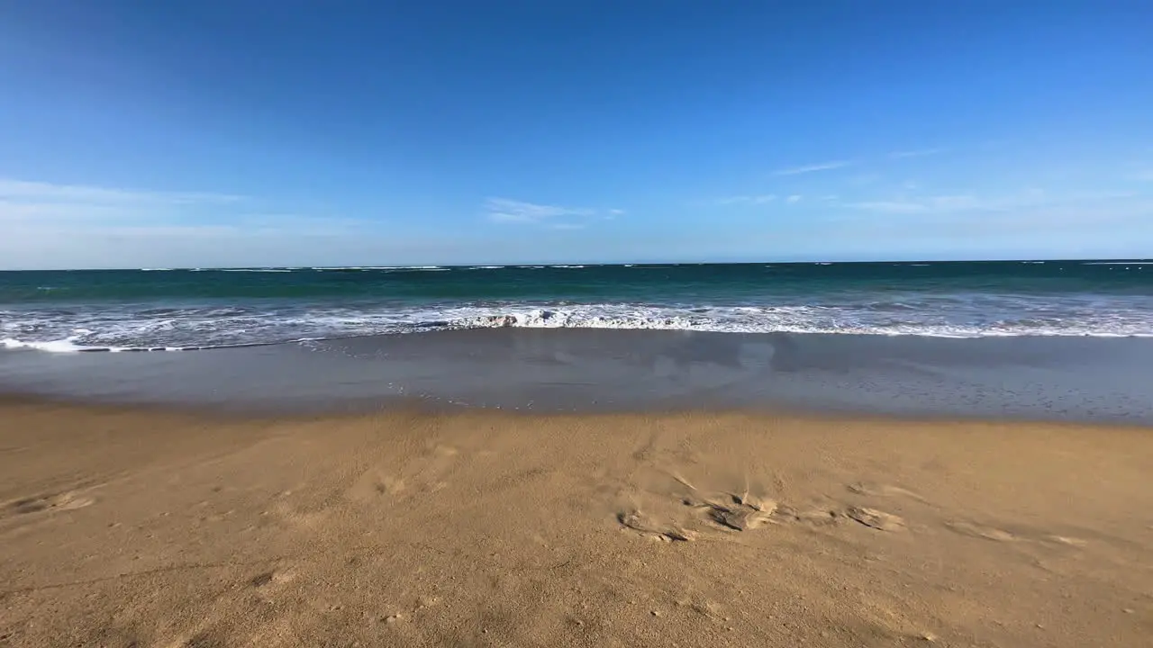 intersecting Caribbean waves as they roll onto the beach in Dominican Punta Cana Hispaniola