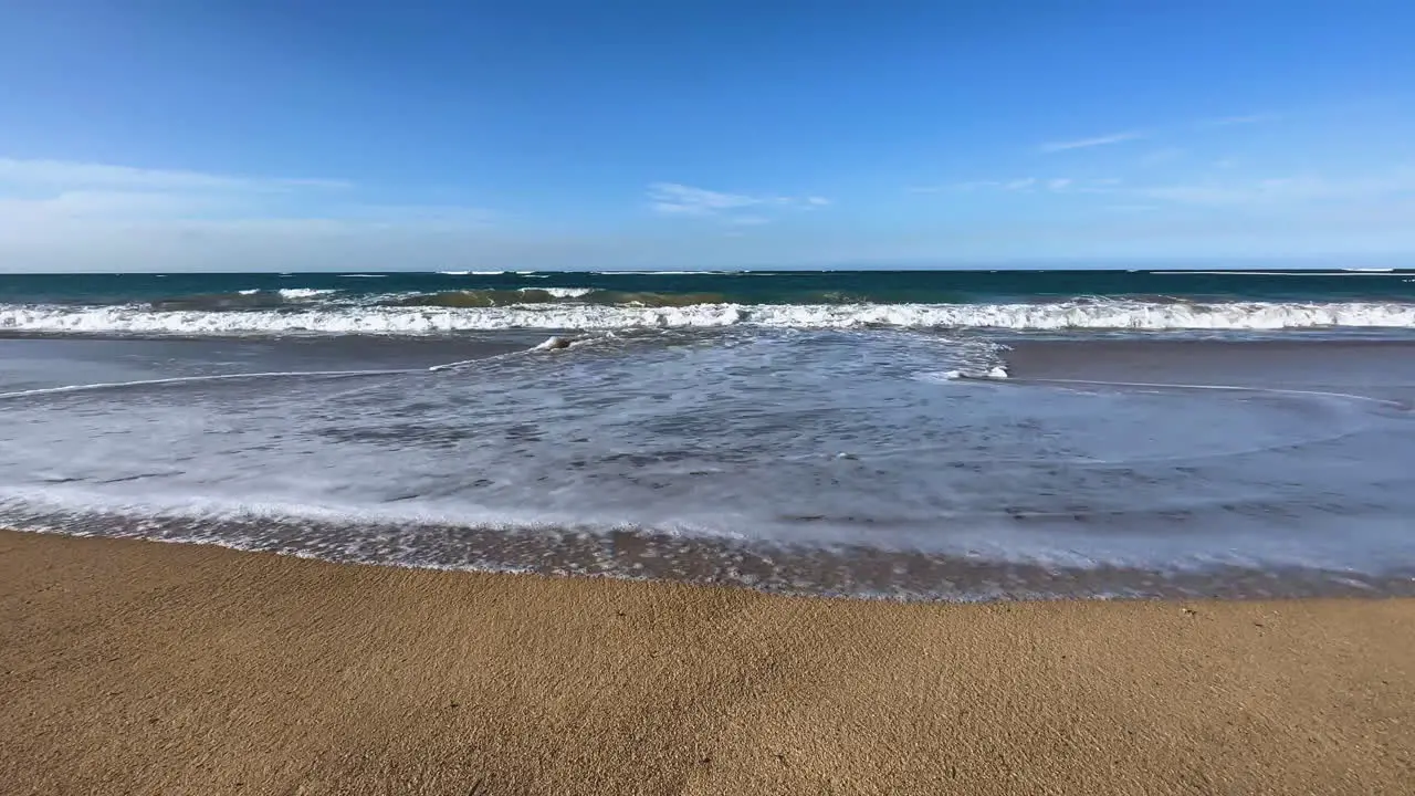 waves rolling onto shore on the island of Hispaniola