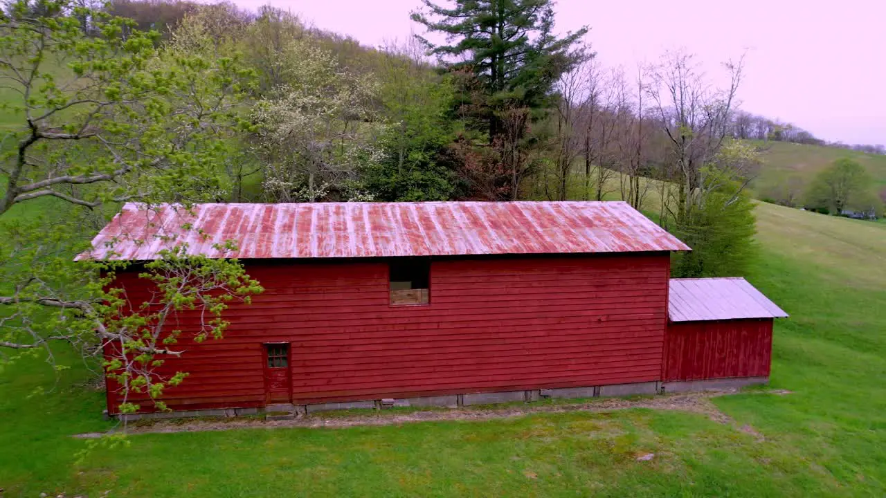 red barn on farm near boone nc north carolina and blowing rock nc in spring