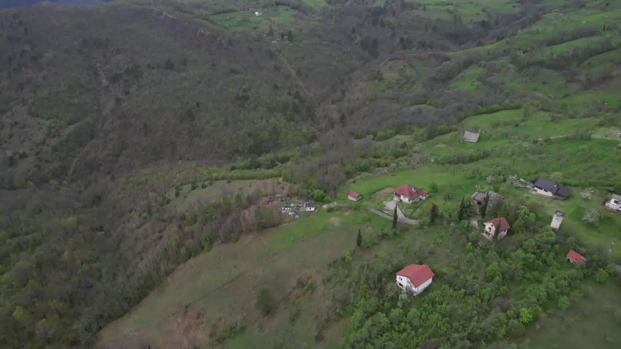 Aerial of typical Bosnian village landscape in the mountains