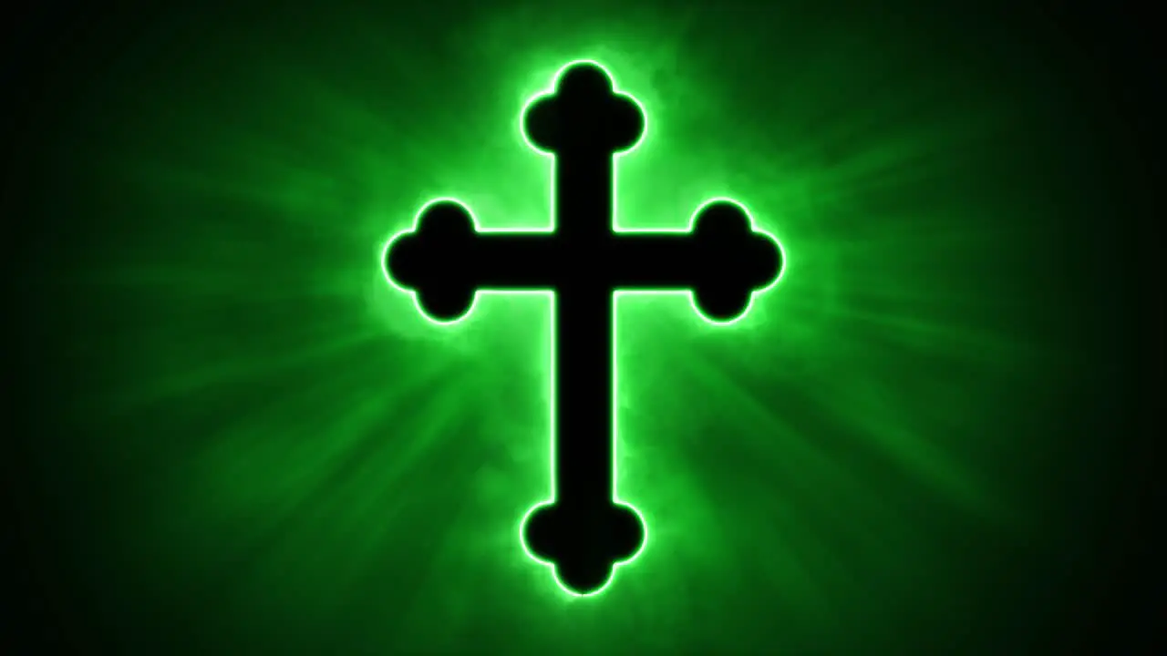 Uplifting and deeply inspiring reveal animation of an ornate and holy green Christian crucifix cross in a smoky mystical glow and emating shining God rays and light beams on a black background