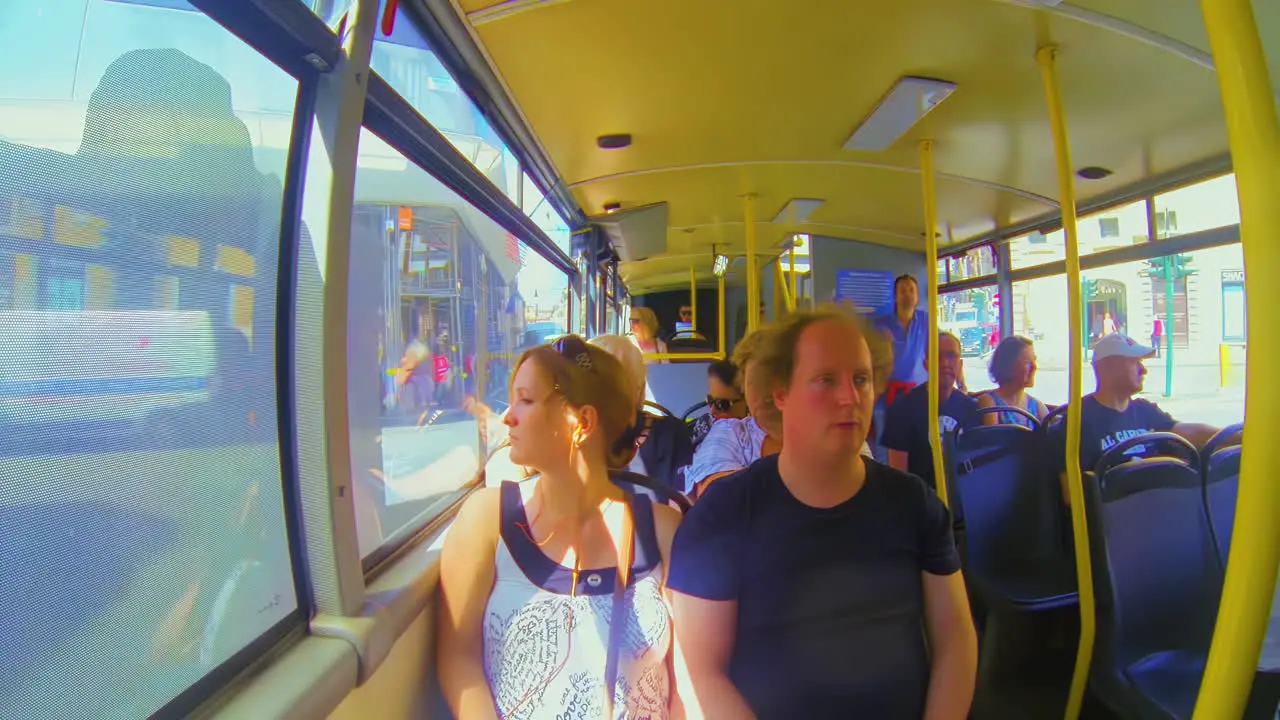 Male female couple on tour in hop on hop off bus in Rome Italy interior