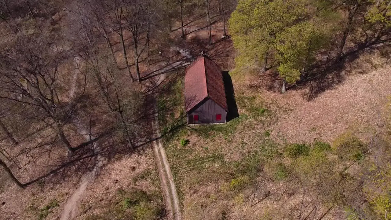 Drone shot from shed in the forest woods with nice sunny weather