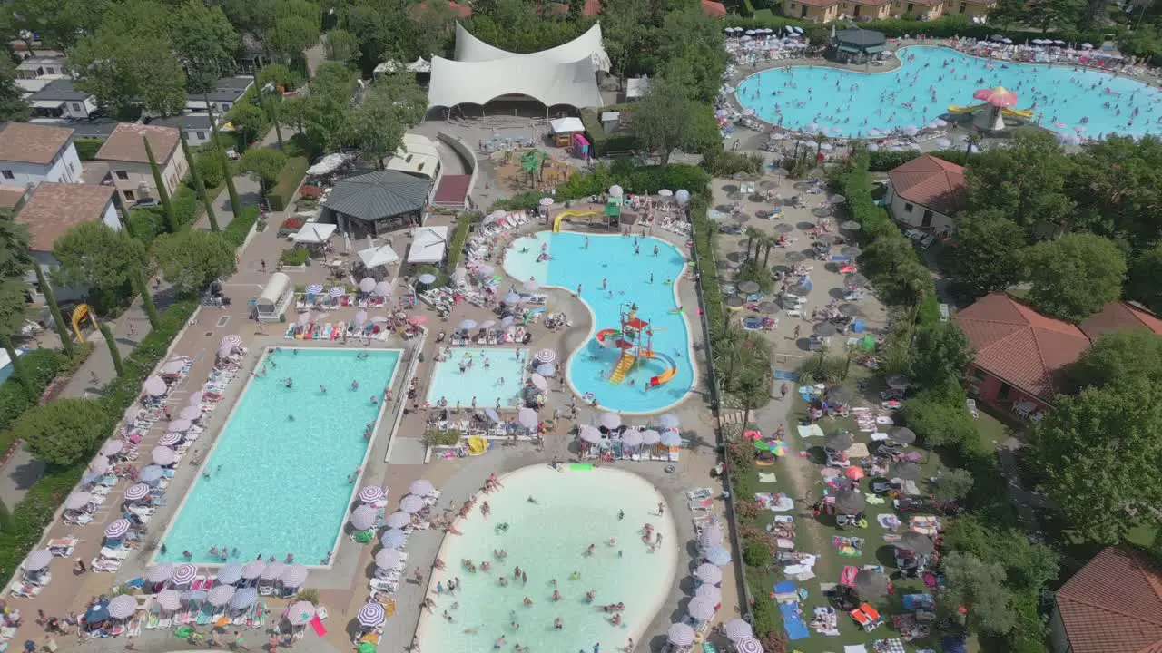 Aerial Shot of People Swimming in Pool Resort in Camping Bella Italia at Lake Garda Italy