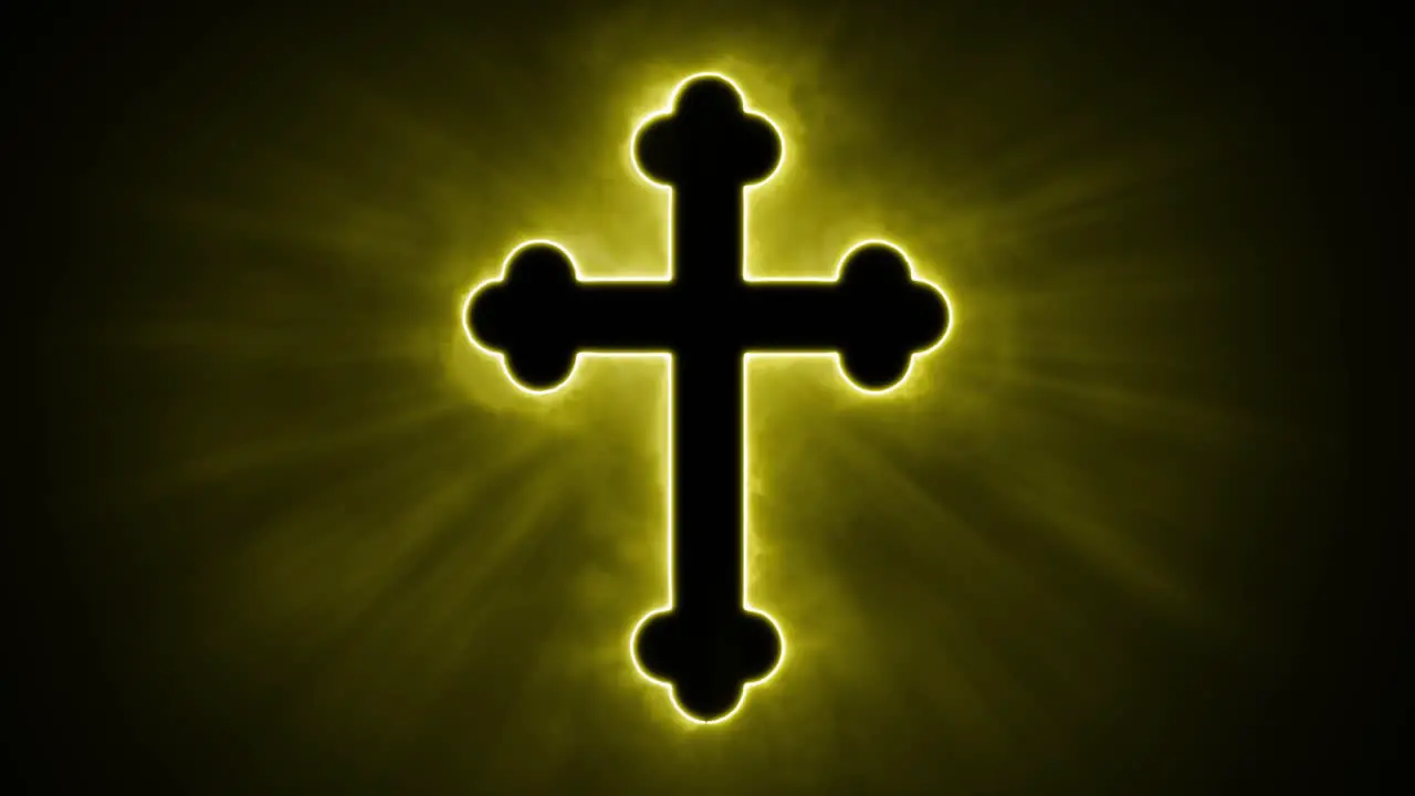 Uplifting and deeply inspiring reveal animation of an ornate and holy golden Christian crucifix cross in a smoky mystical glow and emating shining God rays and light beams on a black background