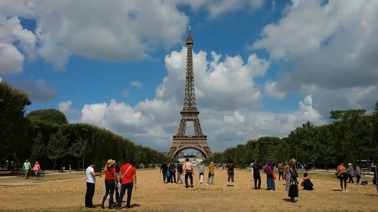 Tourist in Paris near Eiffel tower in the afternoon