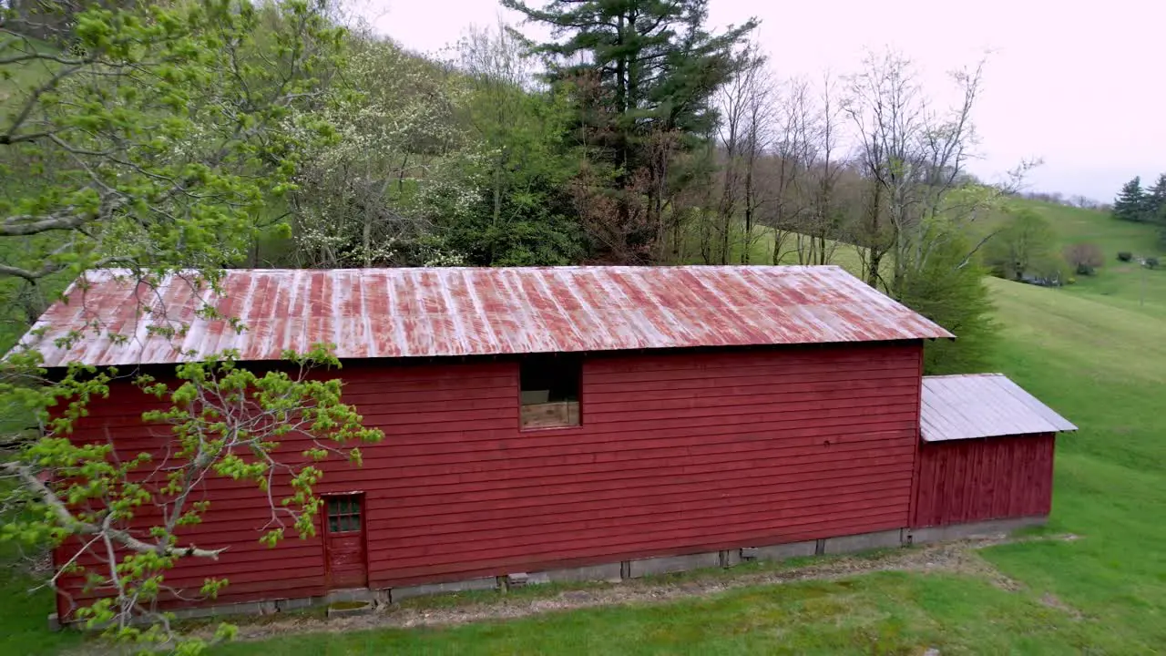 aerial pullout from red barn on farm near boone and blowing rock nc north carolina