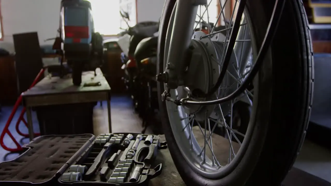 Close-up of motorbike in repair garage 4k