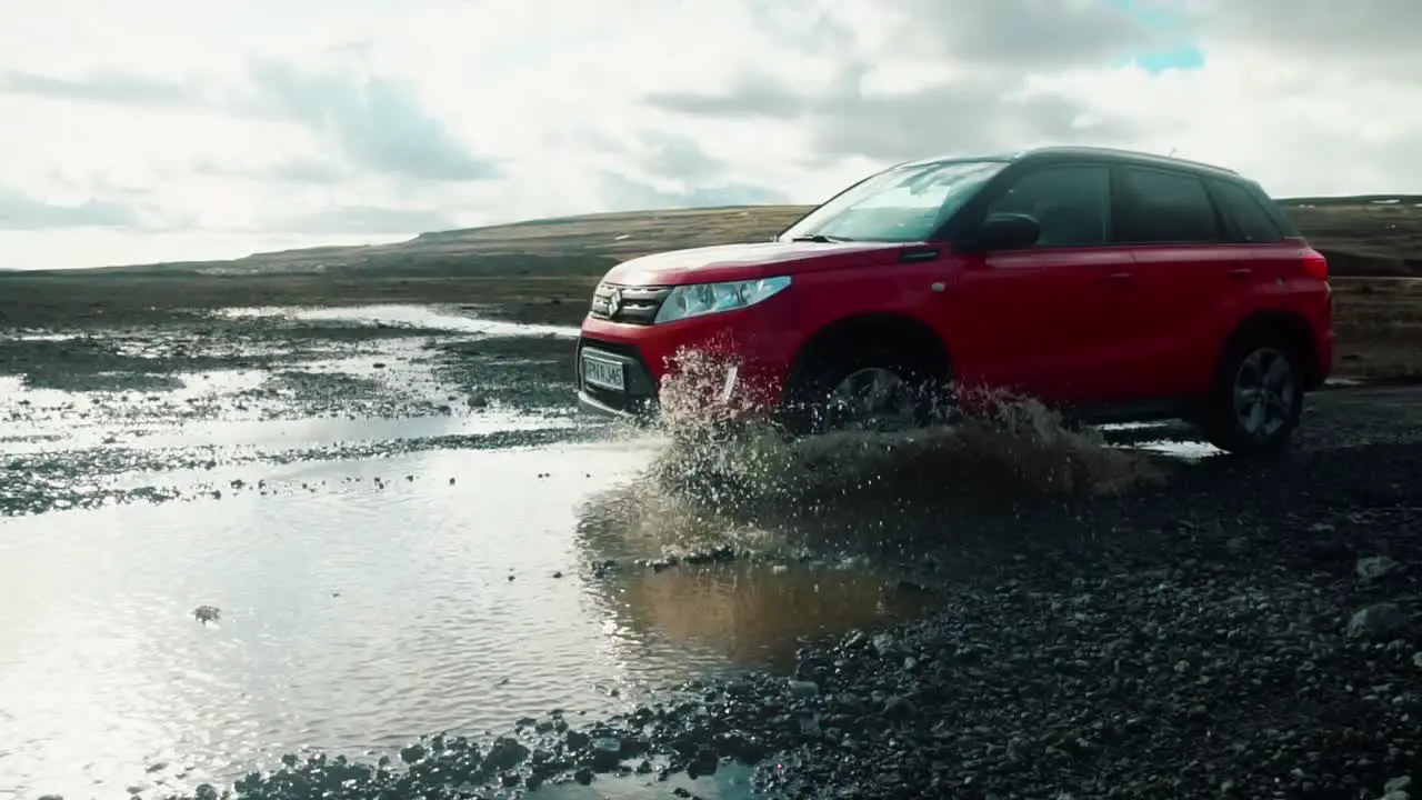 Car Driving Through Puddle In Slow Motion