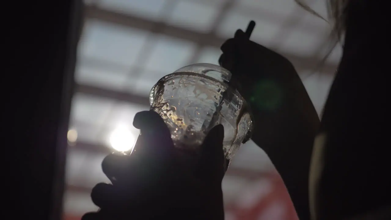 Sipping cocktail with straw