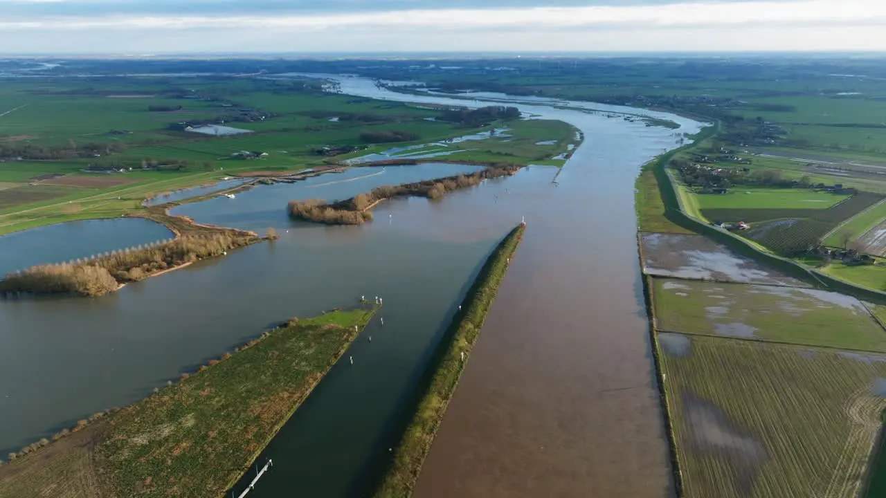 Flood waters break banks of Lek River near Nieuwegein onto farm land