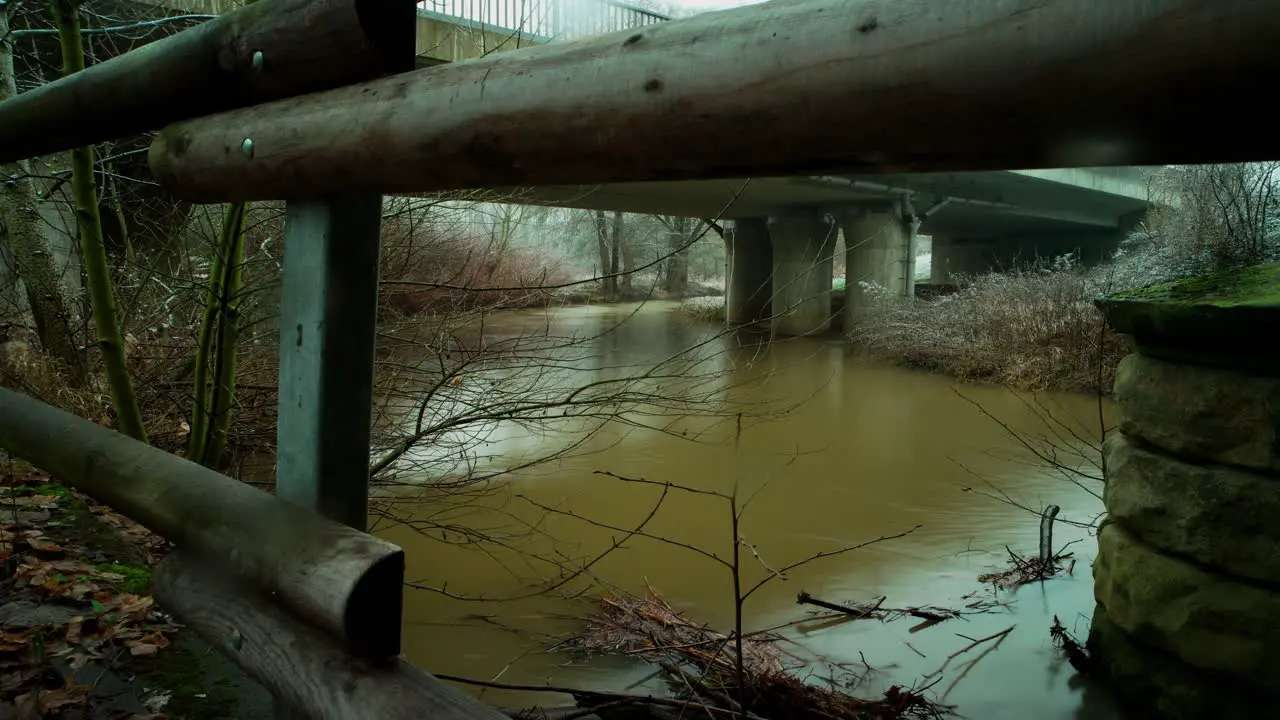 A time-lapse on a winter day under a bridge of a river