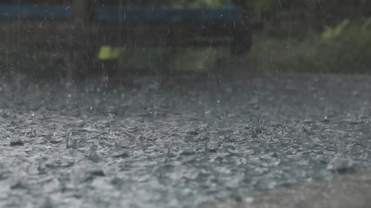 Slow motion raindrops on an infinity pool in Bali