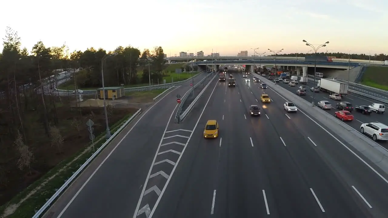 Flying over the city highway in the evening