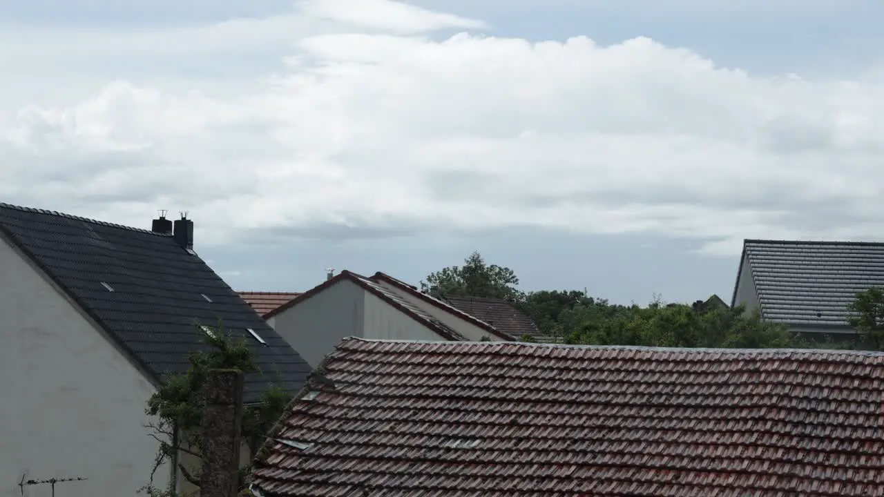 Timelapse shot of the rooftops of a village in France