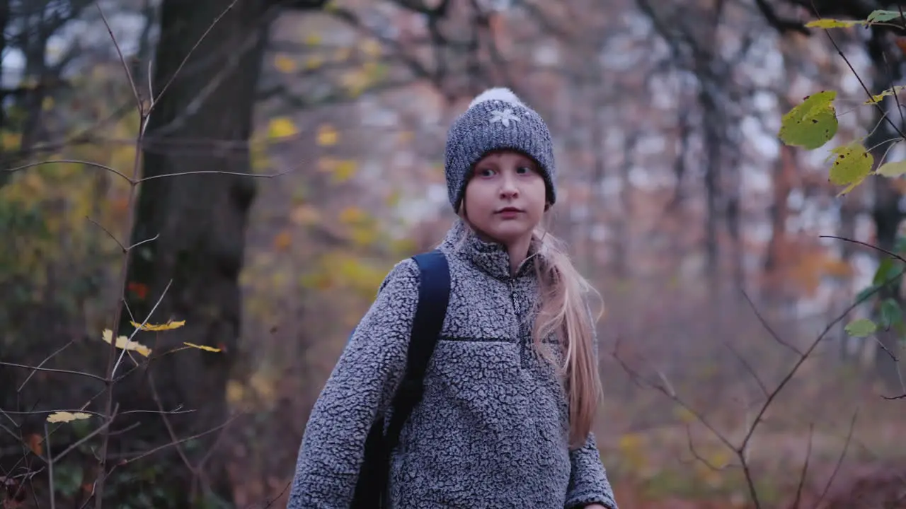 A Little Girl Walks Through The Woods At Dusk A Child Lost In The Woods