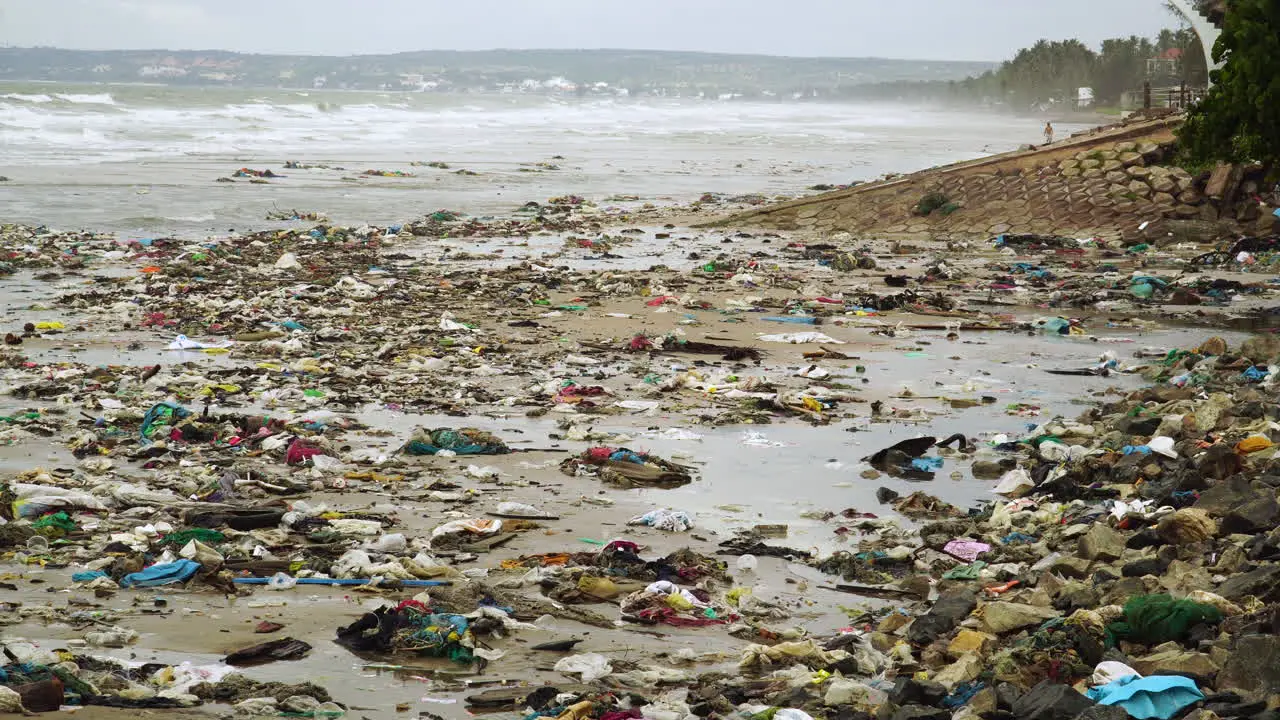 Trash on beach aftermath of typhoon that struck coastline of Mui Ne Vietnam